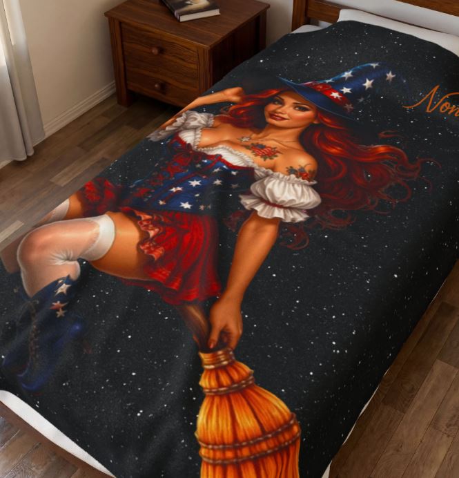 large velveteen patriotic blanket styled on bed featuring red white blue witch artwork for americana decor