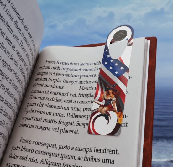 aluminum bookmark displayed on reading surface with patriotic Noni design
