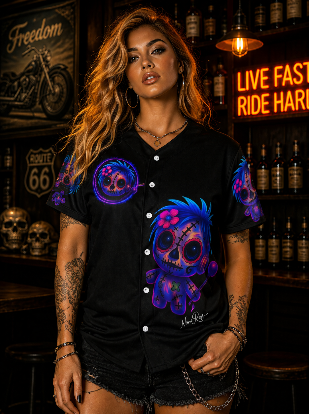 Female model wearing neon Voodoo Vixen jersey shirt front view with glowing chest emblem and large doll graphic